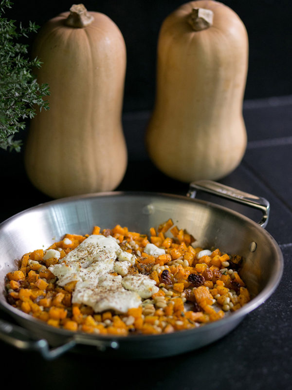 Caramelized-squash-pine-nuts-and-golden-raisins-topped-with-warm-goat-cheese