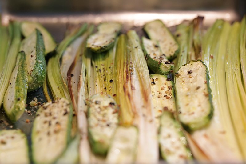 Grilled courgettes and leeks with walnuts and herbs