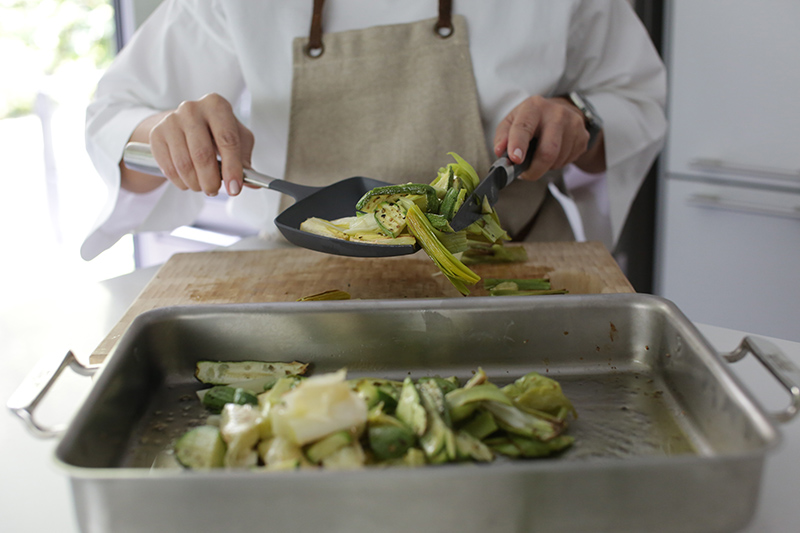 Grilled courgettes and leeks with walnuts and herbs