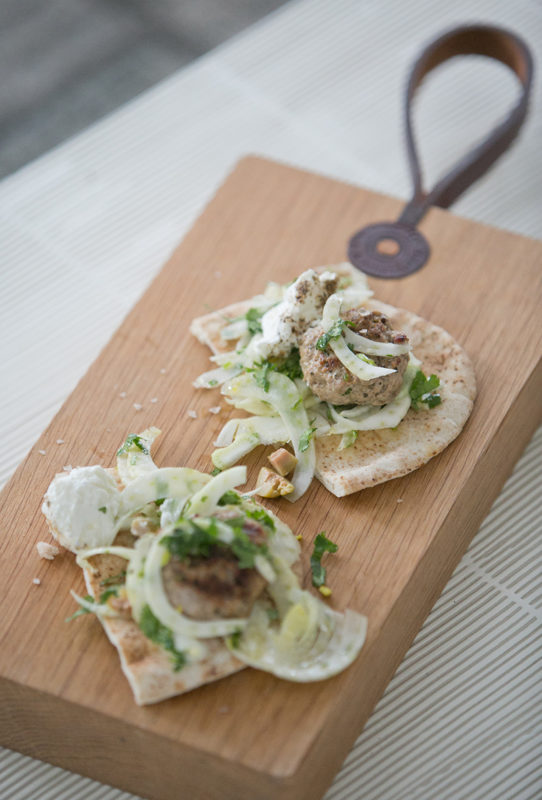 Spicy pork meatballs with fennel and olive salad