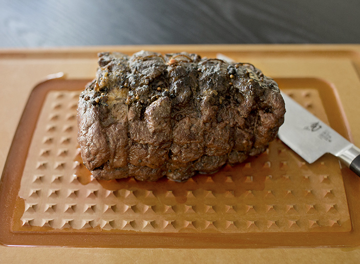 Slow-cooked braised beef on a layer of vegetables